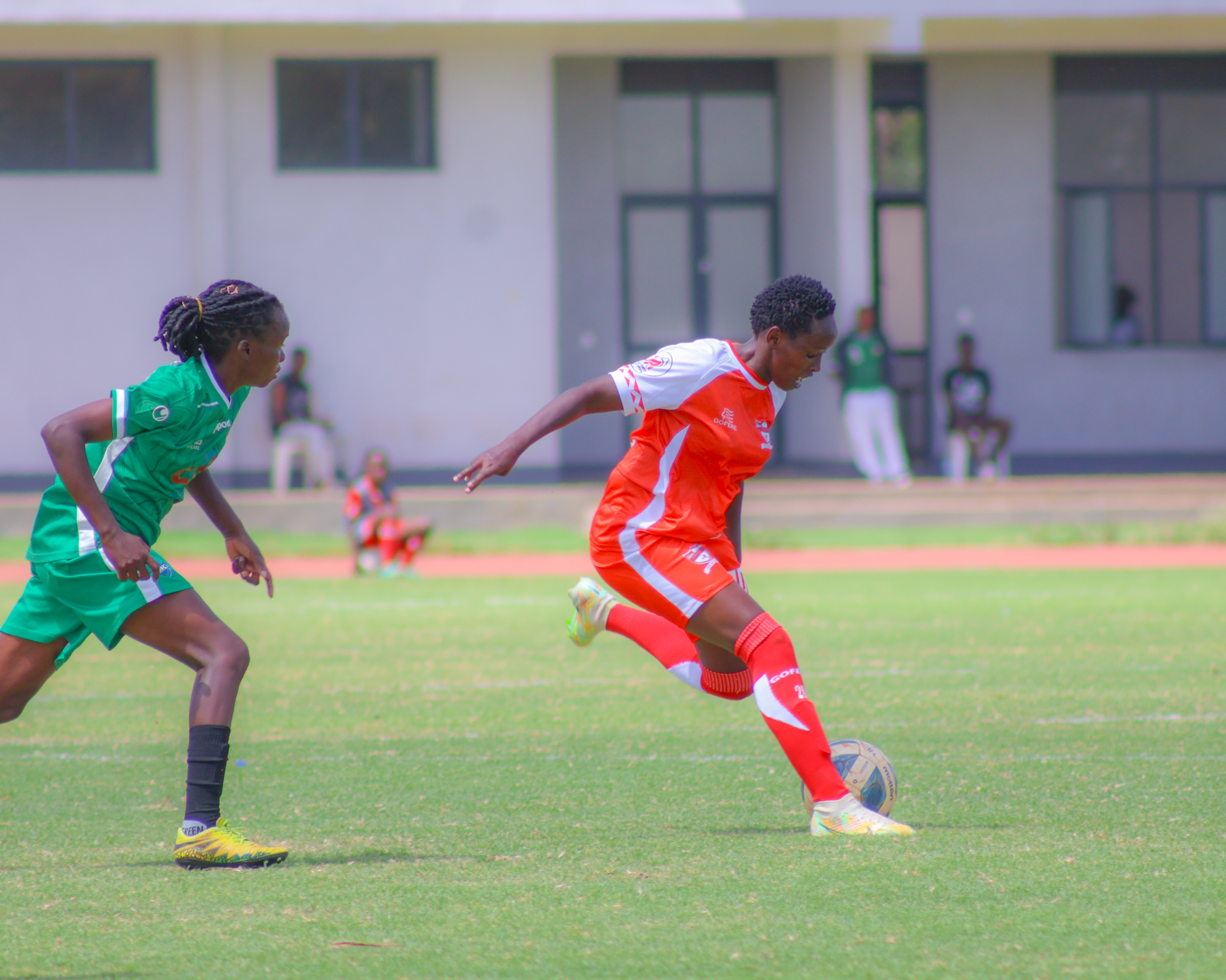 Kayole Starlets Esther Ngugi in Action against Kibera Soccer Women