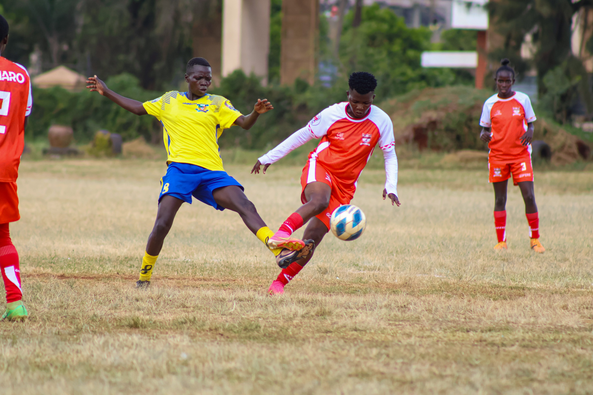 Kayole Starlets Nuru Hadima vies for the ball against Vihiga Queens Martha Amunyolet