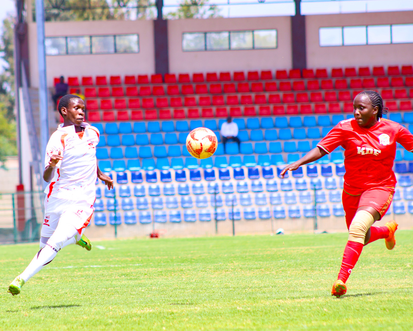 Kayole Starlet's Magneta Ocharo vies for the ball against an Ulinzi Starlet's defender.
