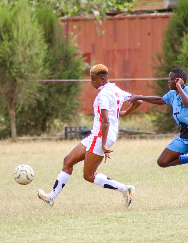 Kayole Starlet's Esther Ngugi and Mary Wali during the clash against Trinity Starlets